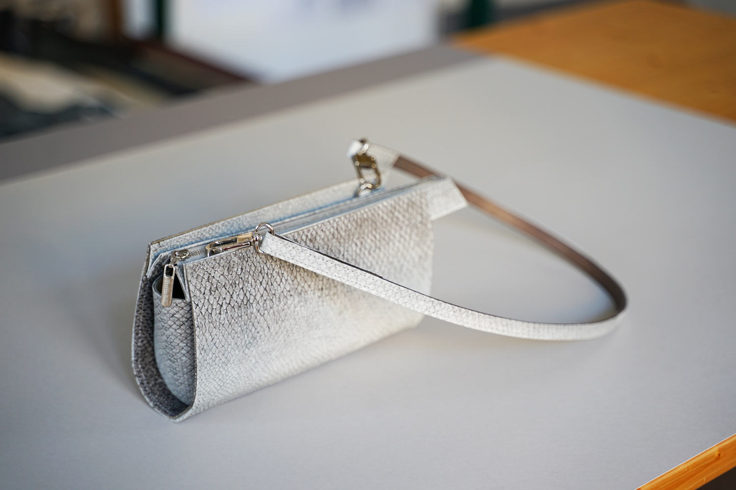 Small handbag made of natural gray salmon leather